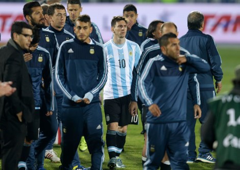 Argentina's Lionel Messi stands with his teammates after the Copa America final game agains Chile at the National Stadium in Santiago, Chile, Saturday, July 4, 2015. Chile's goalkeeper Claudio Bravo made a save and striker Alexis Sanchez converted the winning penalty as host Chile defeated Argentina 4-1 in a shootout after a 0-0 draw in the Copa America final.(AP Photo/Natacha Pisarenko)