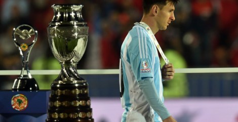 Argentina's forward Lionel Messi walks with the second place medal of the 2015 Copa America football championship, in Santiago, Chile, on July 4, 2015. Chile defeated Argentina 4-1 in the penalty shootout.   AFP PHOTO / RODRIGO ARANGUA        (Photo credit should read RODRIGO ARANGUA/AFP/Getty Images)