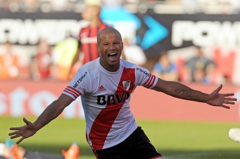 River Plate's midfielder Carlos Sanchez celebrates after scoring a goal against San Lorenzo during their Argentina First Division football match at Antonio Liberti stadium in Buenos Aires, Argentina, on April 5, 2015. AFP PHOTO / STR        (Photo credit should read STR/AFP/Getty Images)