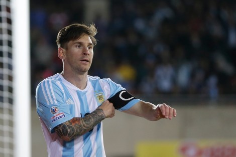 Argentina's Lionel Messi adjustes his captain bracelet during a Copa America Group B soccer match at La Portada stadium in La Serena, Chile, Saturday, June 13, 2015. (AP Photo/Ricardo Mazalan)